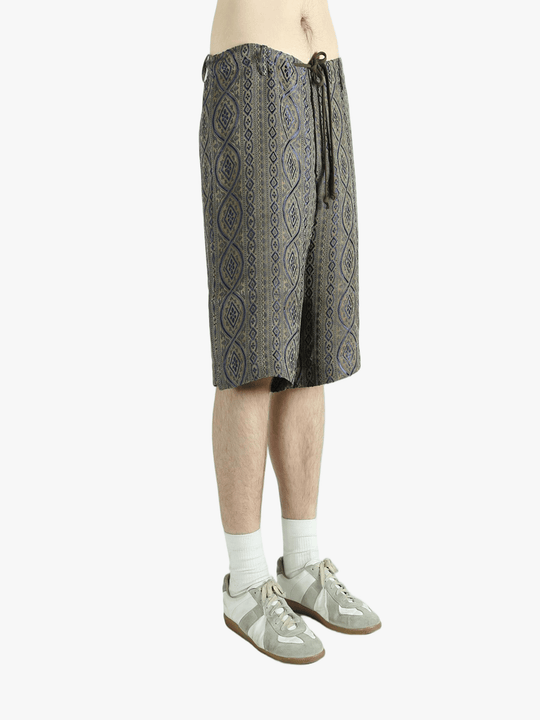 Blue pants worn by a person, showing the pants' fit