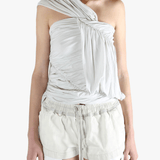 White tops worn by a person, showing the tops fit