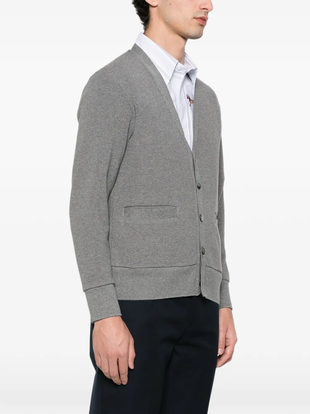 Grey cardigan worn by a person, showing the cardigan fit
