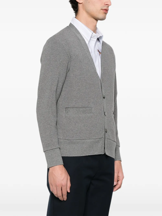 Grey cardigan worn by a person, showing the cardigan fit