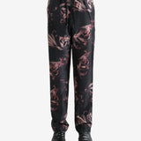 Black pants worn by a person, showing the pants' fit