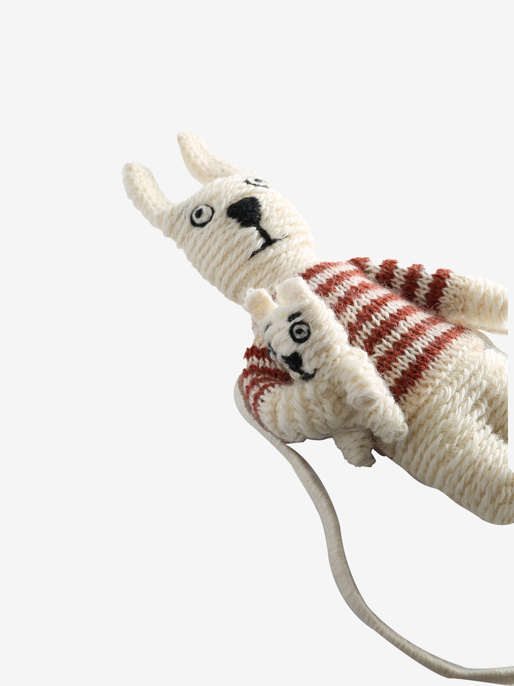 Close up of white doll, showing texture of the wool and cotton fabric