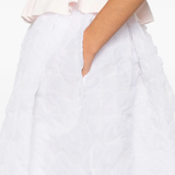 Close up of white skirt, showing texture of the Cupro fabric