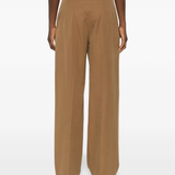 Yellow pant  worn by a person, showing the pant's fit