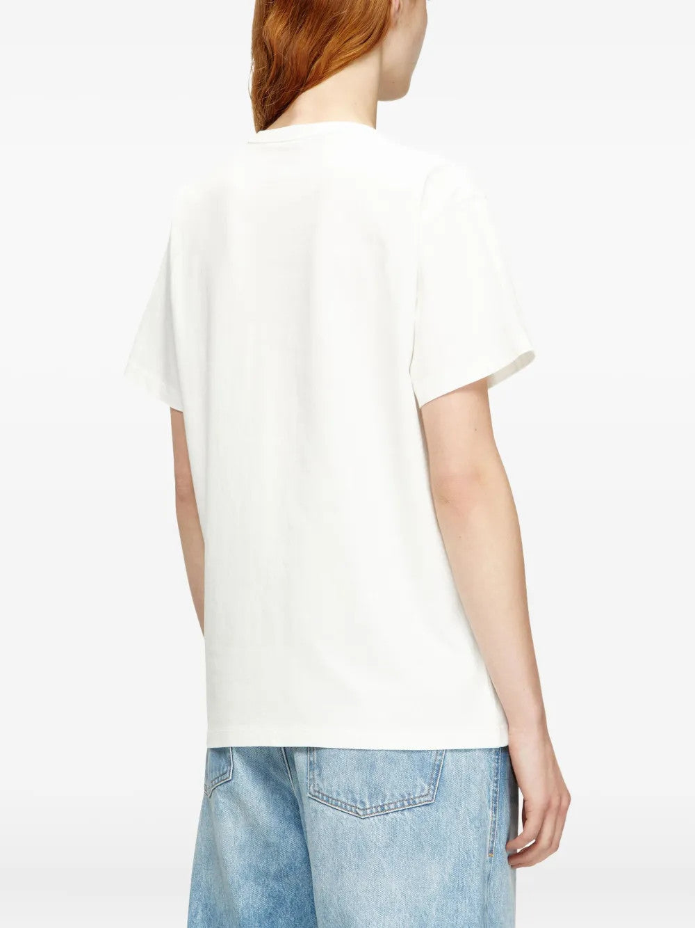 White t-shirt worn by a person, showing the t-shirt fit