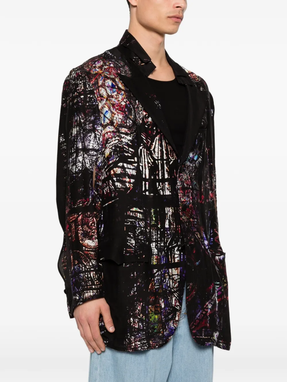 Black jacket worn by a person, showing the jacket's fit