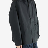 Black jacket worn by a person, showing the jacket's fit