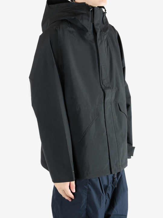 Black jacket worn by a person, showing the jacket's fit