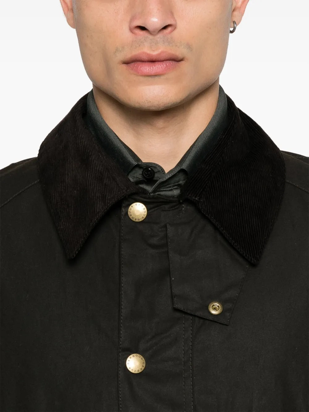 Close up of the brown jacket, showing texture of the cotton fabric
