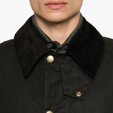 Close up of the brown jacket, showing texture of the cotton fabric
