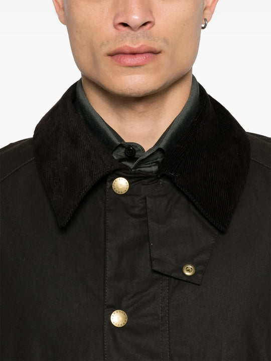 Close up of the brown jacket, showing texture of the cotton fabric
