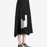 Black skirt worn by a person, showing the skirt fit