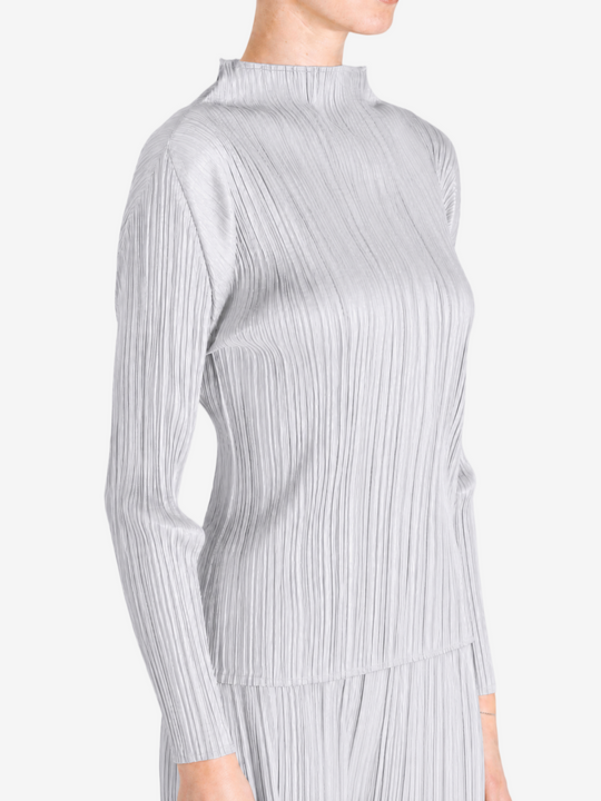 Grey shirt worn by a person, showing the shirt fit