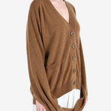 Brown knitwear worn by a person, showing the knitwear fit