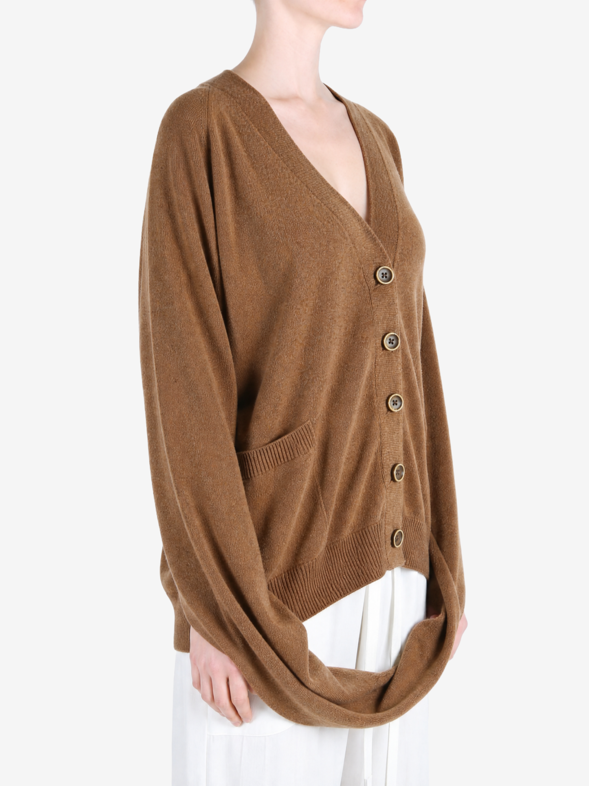Brown knitwear worn by a person, showing the knitwear fit