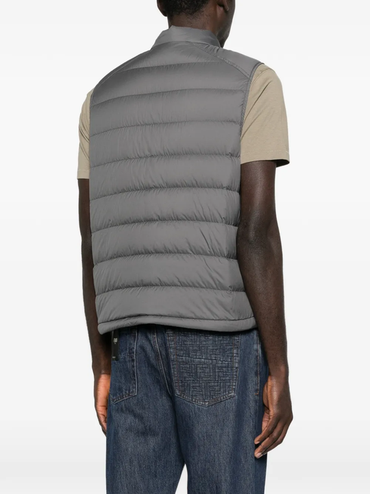 Grey vest worn by a person, showing the vest fit