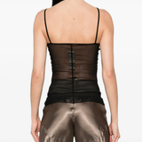 Black top worn by a person, showing the top fit