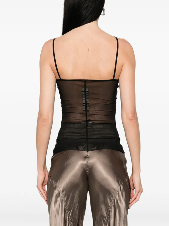 Black top worn by a person, showing the top fit