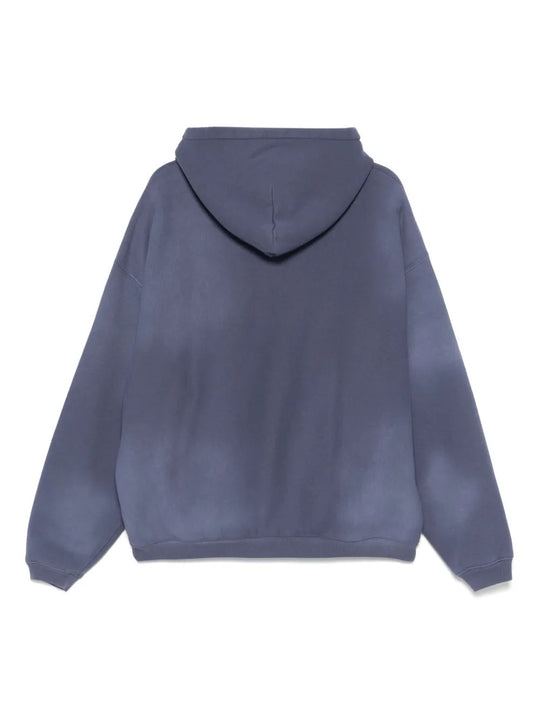 Blue hoodie, back view showing relaxed fit