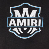 Close up of the black hoodie, showing texture of the cotton fabric