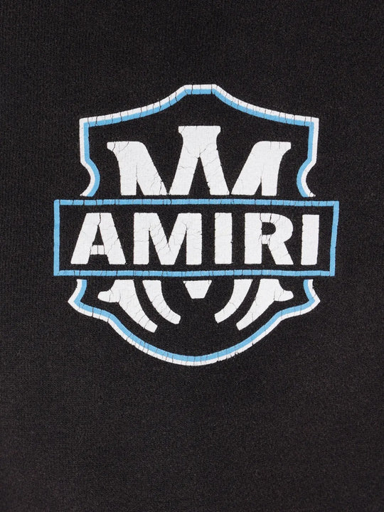 Close up of the black hoodie, showing texture of the cotton fabric