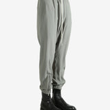 Grey pants worn by a person, showing the pants's fit