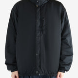 Black jacket worn by a person, showing the jacket's fit