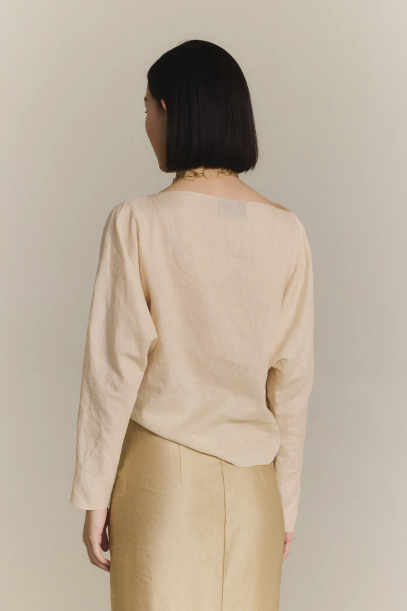 Tan top worn by a person, showing the top fit