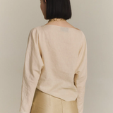 Tan top worn by a person, showing the top fit