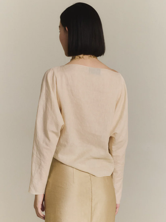Tan top worn by a person, showing the top fit