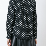 Black shirt  worn by a person, showing the shirt's fit