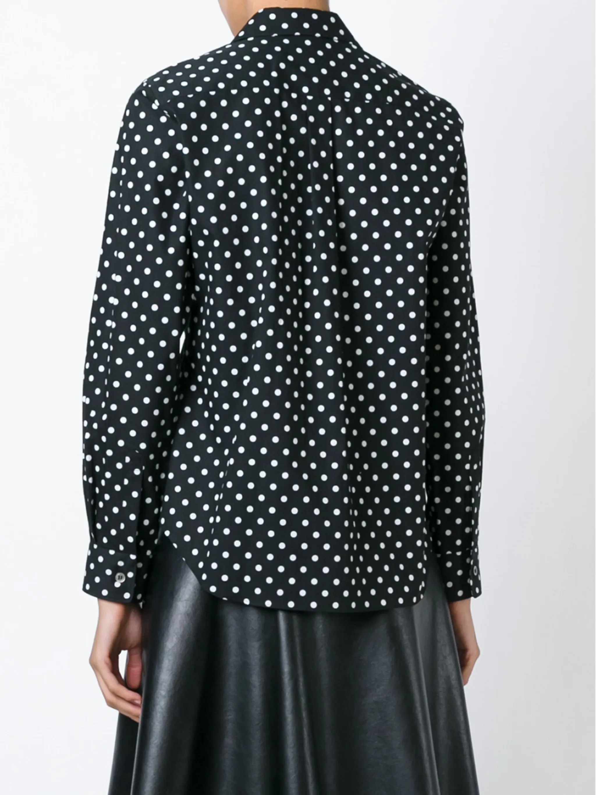 Black shirt  worn by a person, showing the shirt's fit