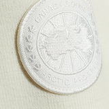 Close up of White jacket, showing texture of the 100% polyamide fabric