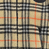 Close up of tan jackets, showing texture of the wool and polyester fabric