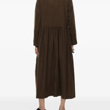 Brown dress worn by a person, showing the dress's fit