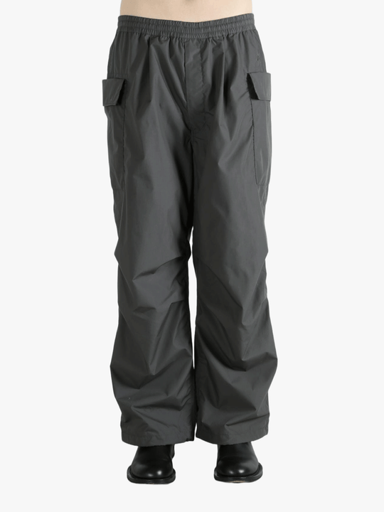 Grey pants worn by a person, showing the pants fit