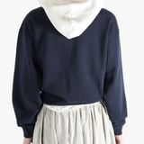 Navy parka worn by a person, showing the parka's fit