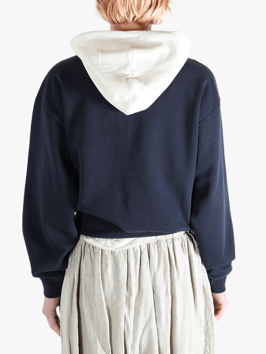 Navy parka worn by a person, showing the parka's fit