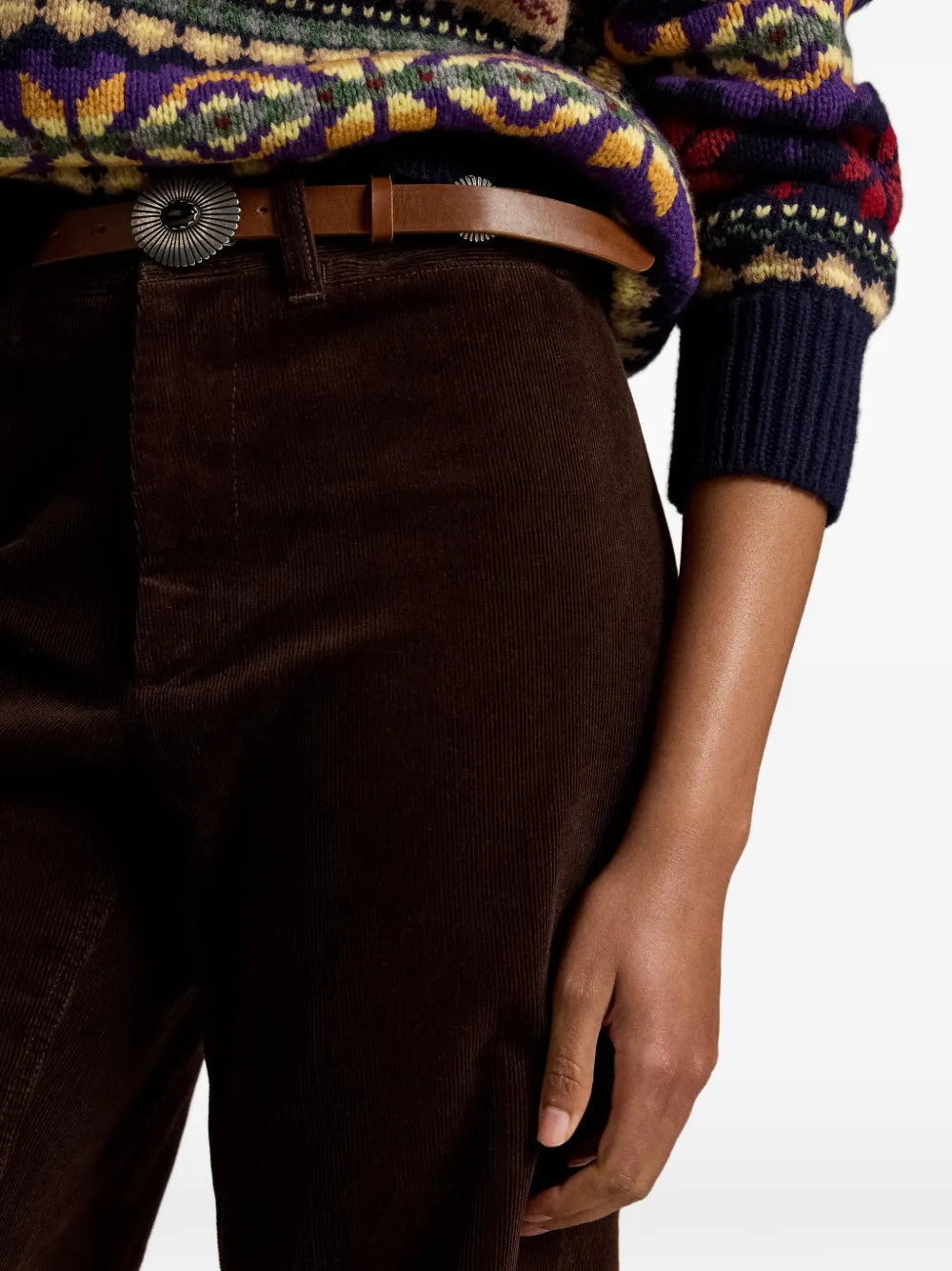Brown pants worn by a person, showing the pants fit