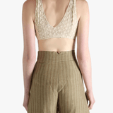 Tan bra worn by a person, showing the bra's fit