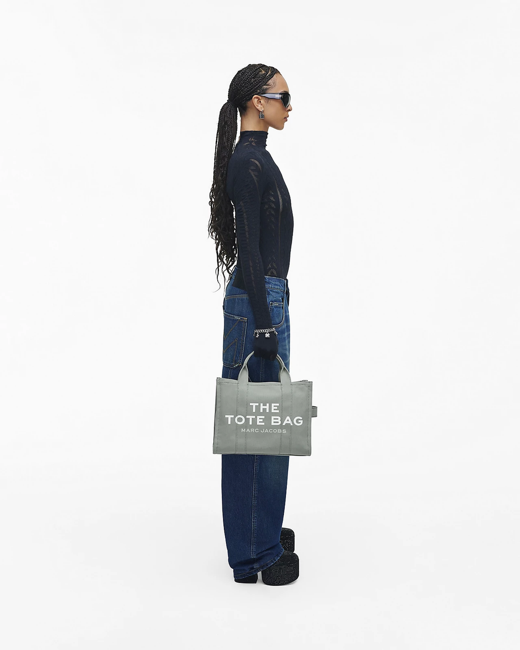 Blue bag carried by a person, showing the bag’s fit