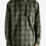 Black shirt worn by a person, showing the shirt's fit