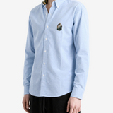 Blue shirt worn by a person, showing the shirt fit