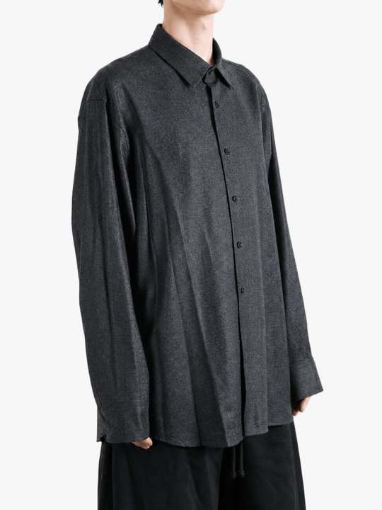 Grey shirt worn by a person, showing the shirt fit