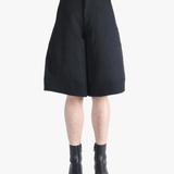 Black shorts worn by a person, showing the shorts fit