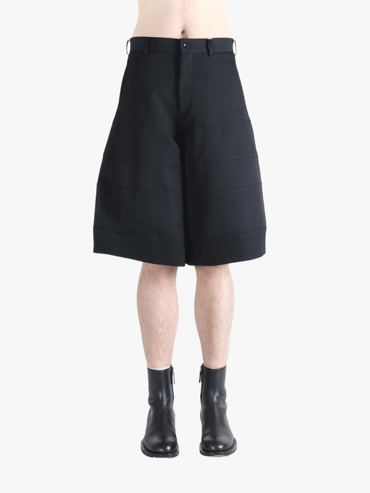 Black shorts worn by a person, showing the shorts fit