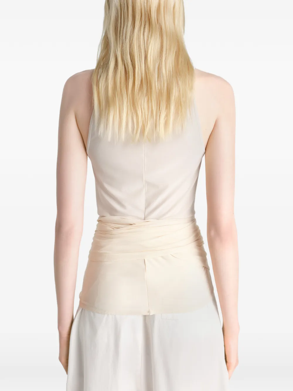 Tan top worn by a person, showing the top fit