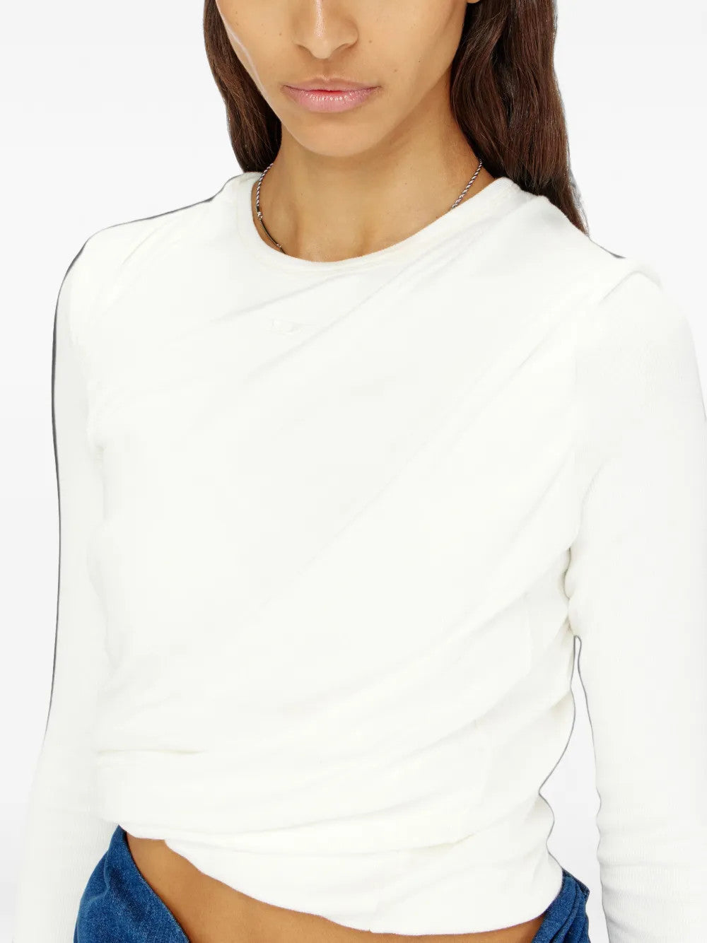 White top worn by a person, showing the top fit