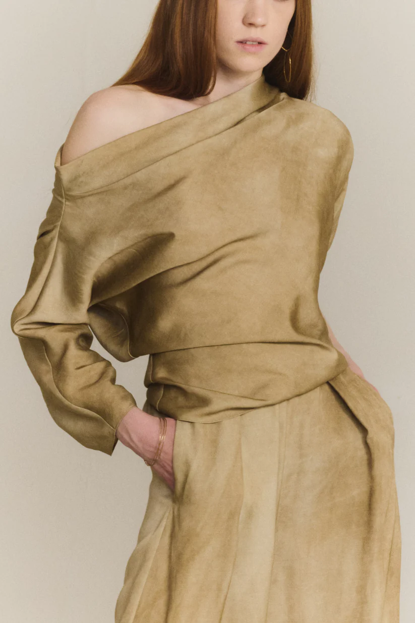 Brown top worn by a person, showing the top fit
