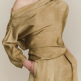 Brown top worn by a person, showing the top fit